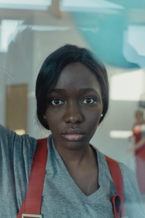 Woman Wearing a Gray Shirt Staring