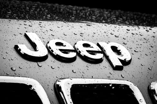 Close-up of a Jeep Badge on a Car Hood 