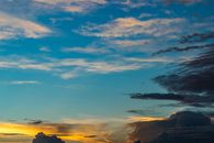 Dark clouds over bight sky at sunset