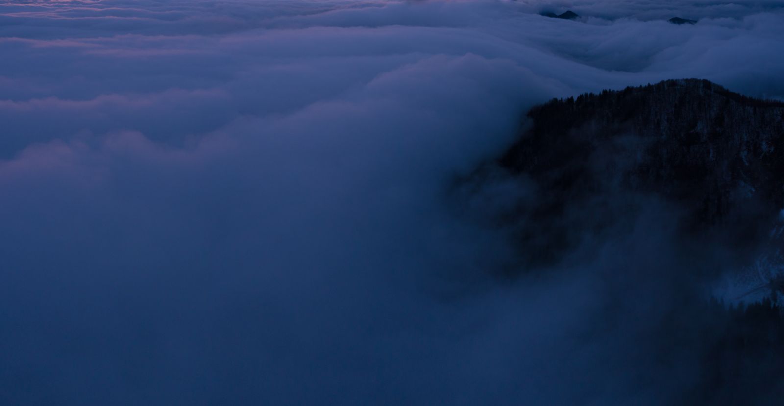 Misty mountain ridge at twilight — photo by Rok Romih on Pexels