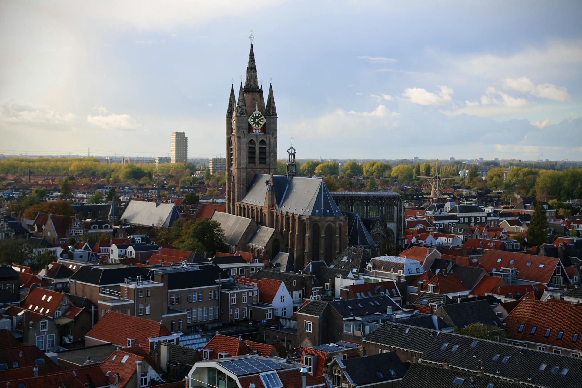 Stunning aerial view of Nieuwe Kerk in Delft showcasing historical architecture and cityscape.