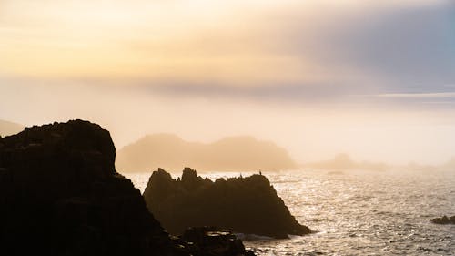 Silhouette of Rocks by the Sea 