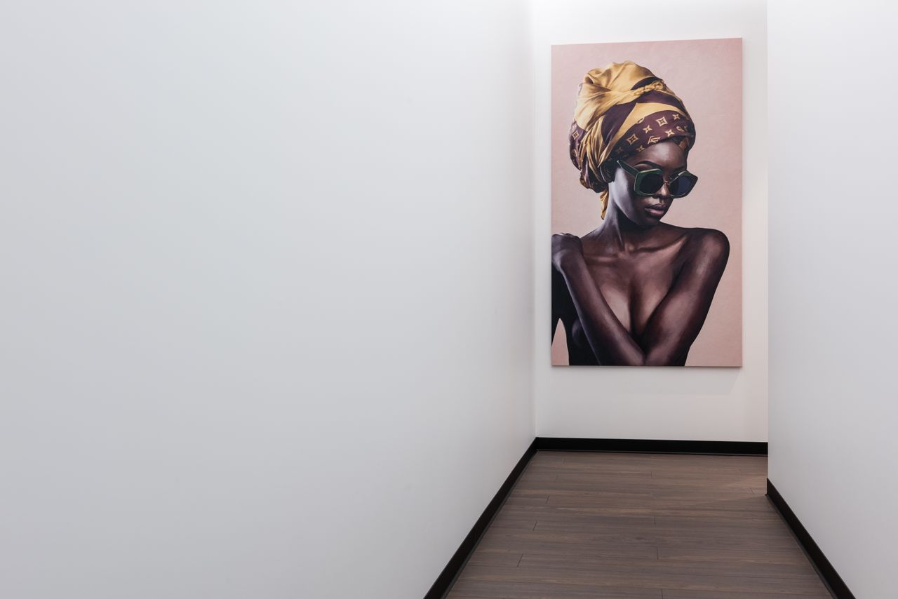 Bright hallway with artwork illuminated on the wall
