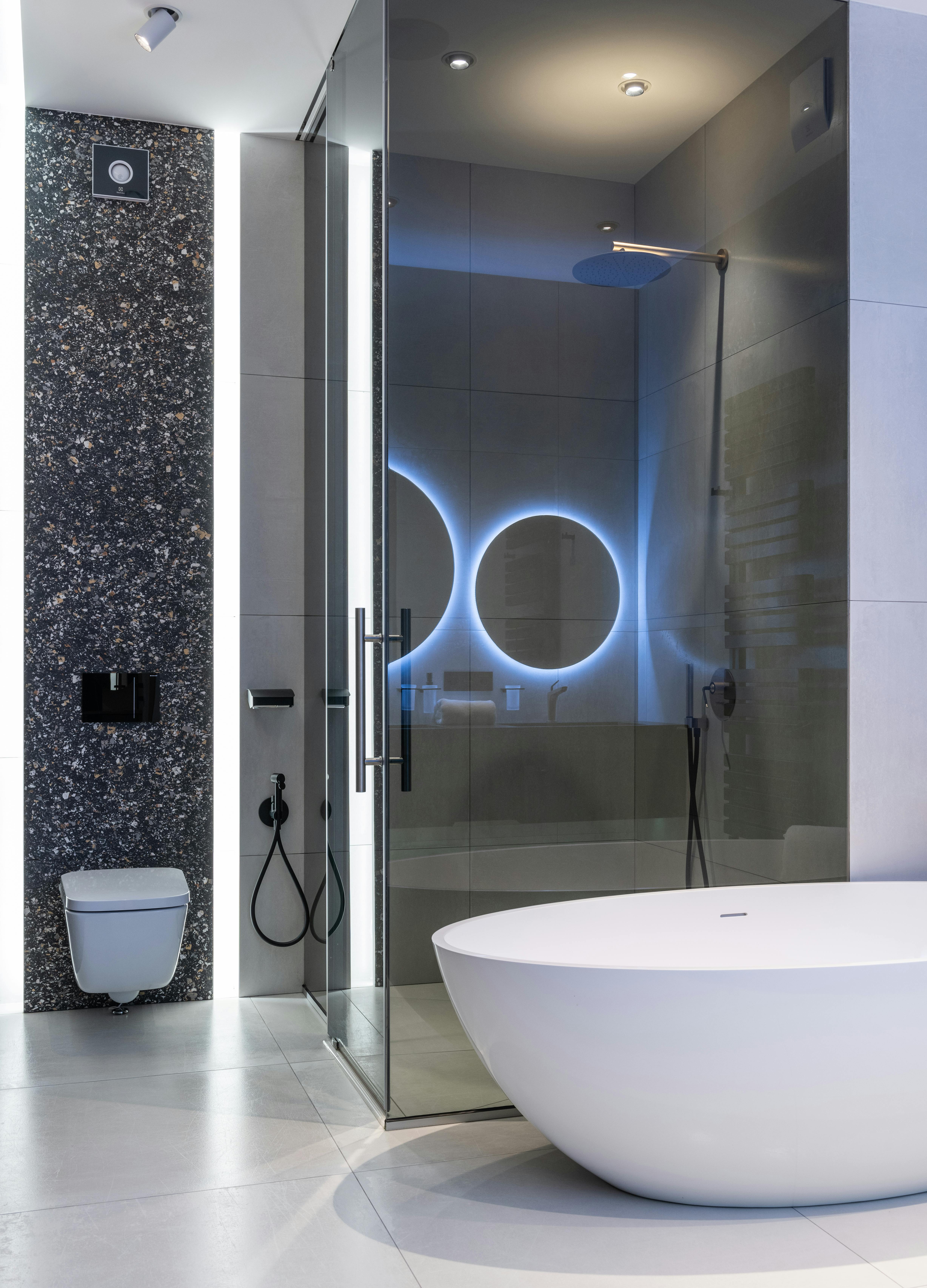 interior of modern spacious bathroom with bright lamps