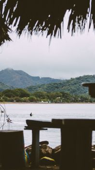 Serene view of a tranquil lake surrounded by lush hills in Guanacaste, Costa Rica.