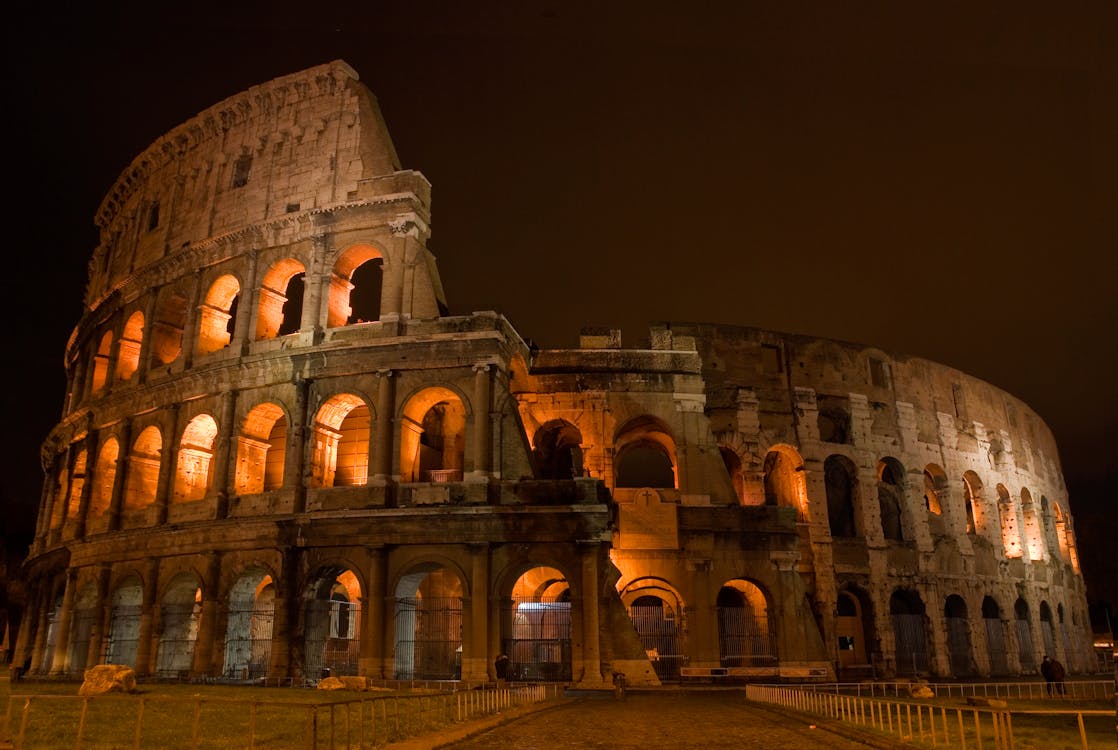 Facade Of An Ancient Colosseum At Night · Free Stock Photo