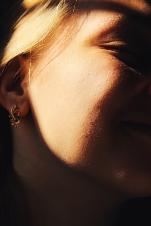 Woman Wearing Gold Earring