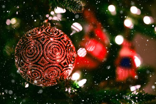 Xmas decorations hanging on fir tree during festive event