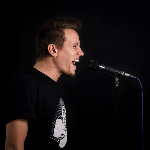 Singer at a vintage ribbon microphone — photo by YAUHENI ZAITSAU on Pexels