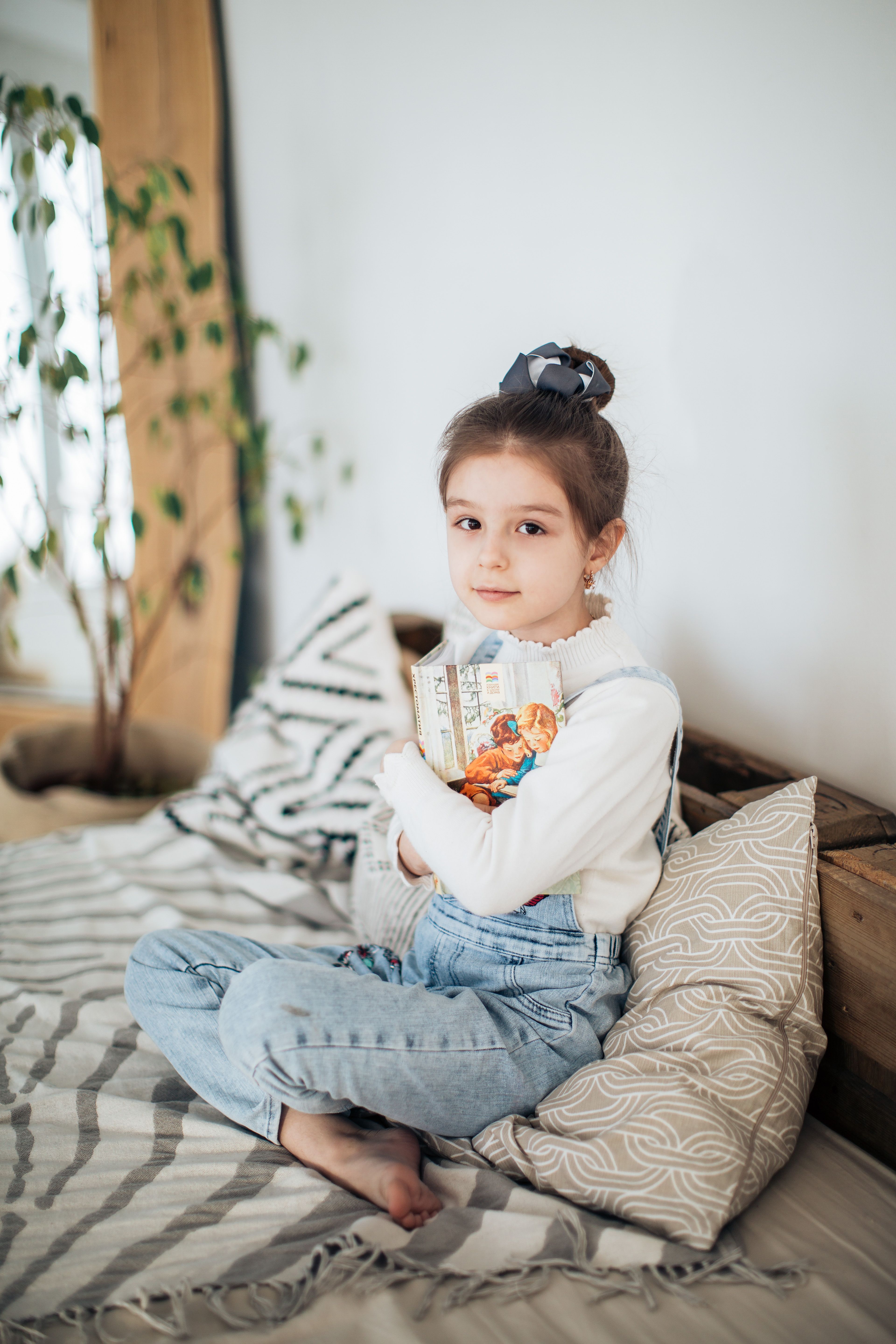 Girl in White Long Sleeve Shirt Lying on a Bed · Free Stock Photo