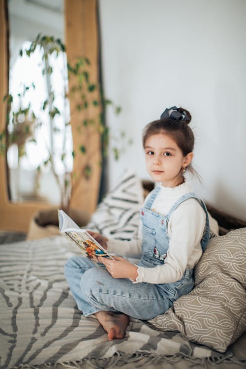 Free Pretty Young Girl Holding a Book Stock Photo