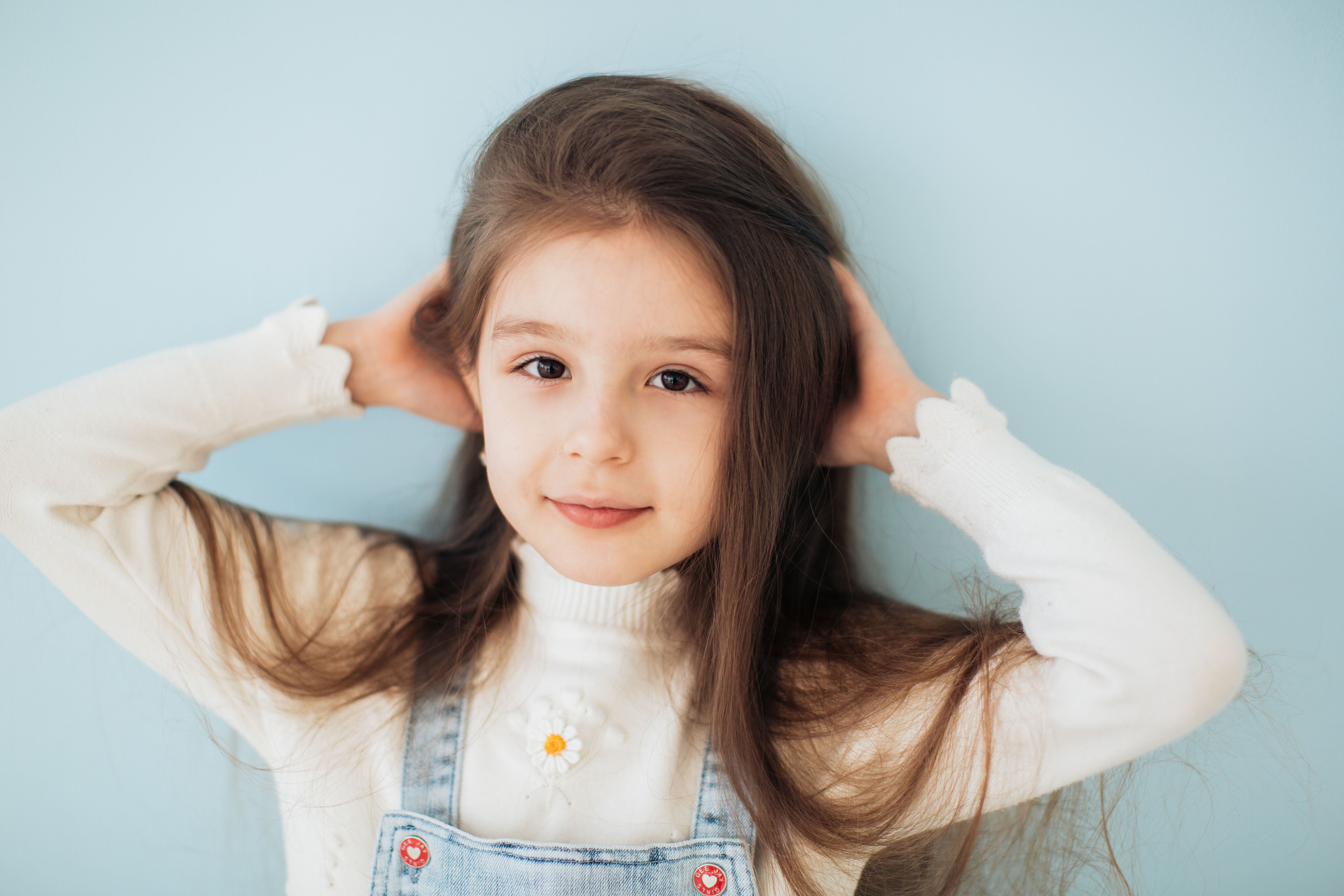 Girl With Hands on Her Head Looking at the Camera · Free Stock Photo