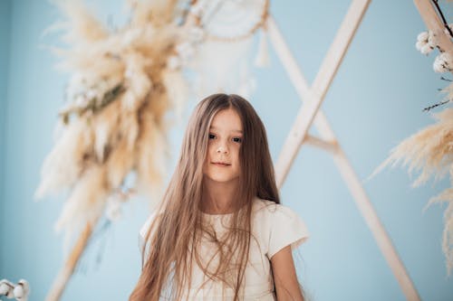 Portrait of a Girl with Brown Hair Wearing a White Top