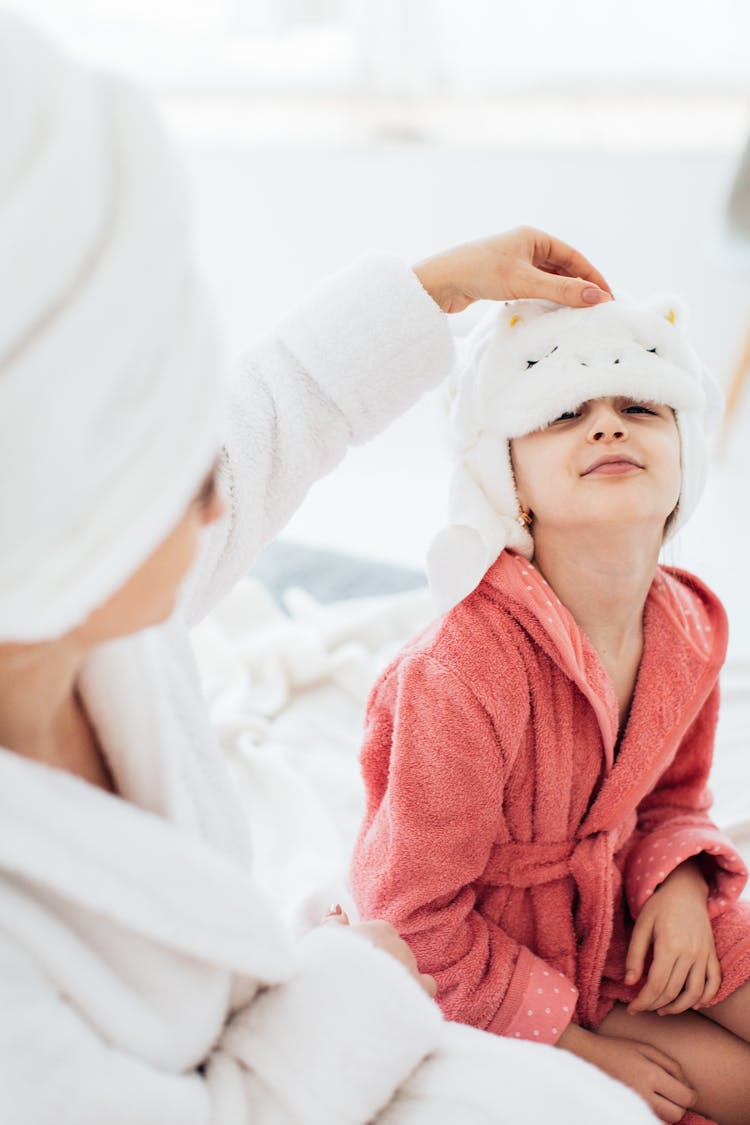 Mother Putting Towel On Daughter Head