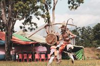 Performers engaging in a traditional tribal dance in a rural village in Nusa Tenggara, Indonesia.