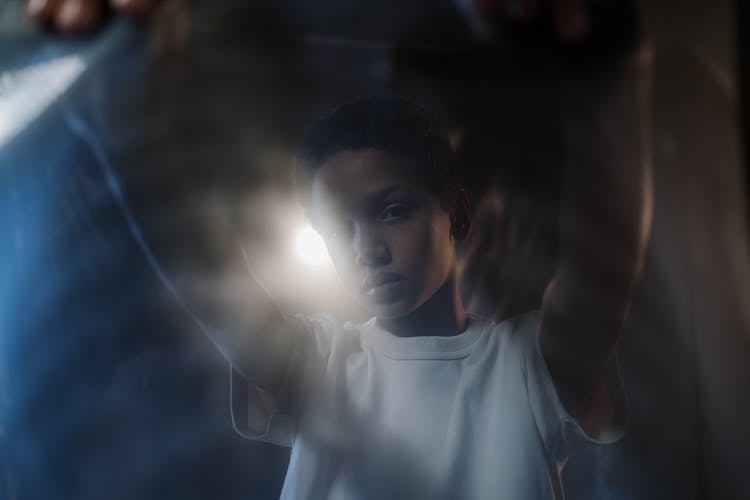 A Boy Holding An Xray Film