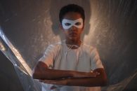 Boy in White Crew Neck T-shirt Wearing White Eye Mask