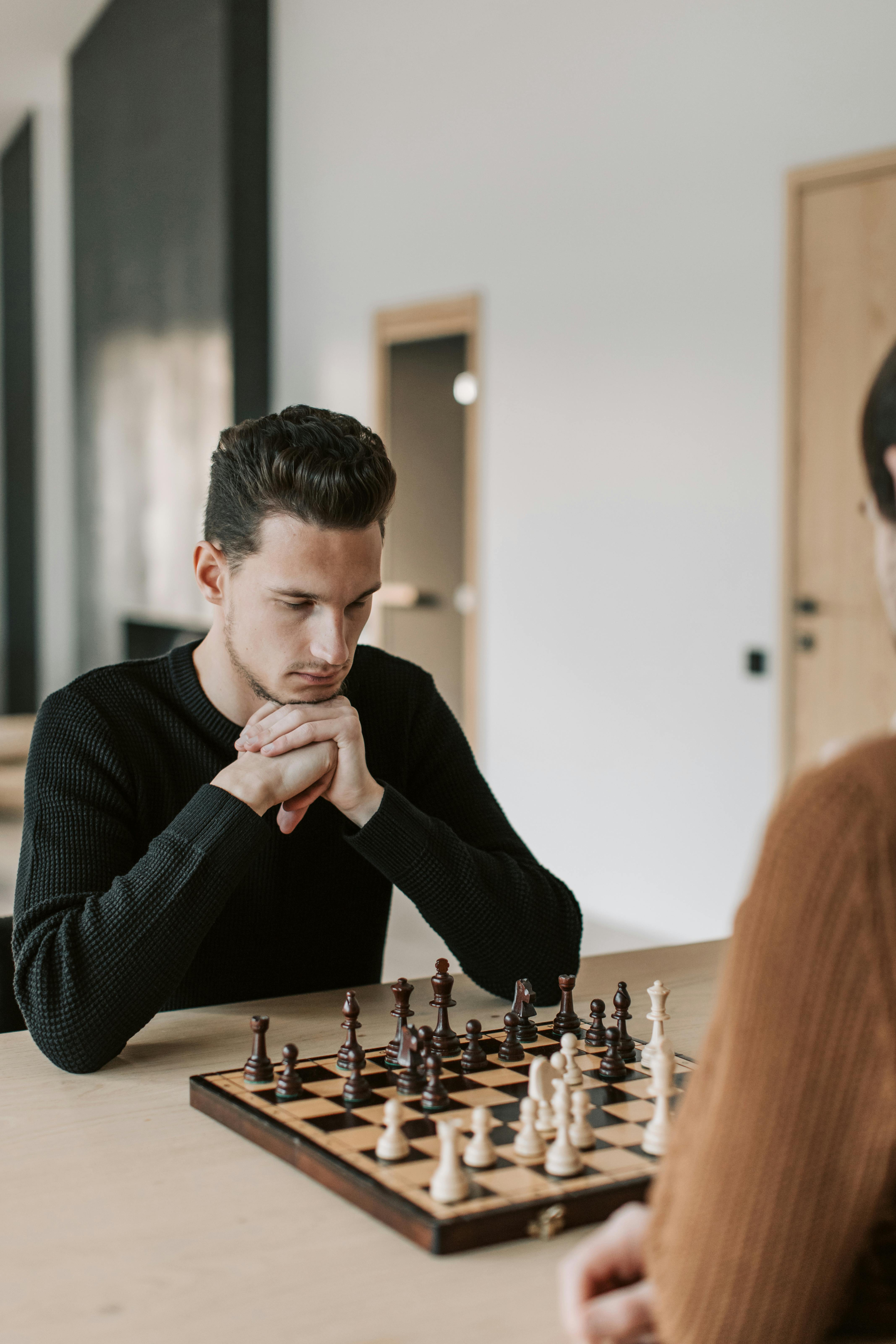 Man Playing Chess Against Himself Shot In The Studio Stock Photo, Picture  and Royalty Free Image. Image 30682890.