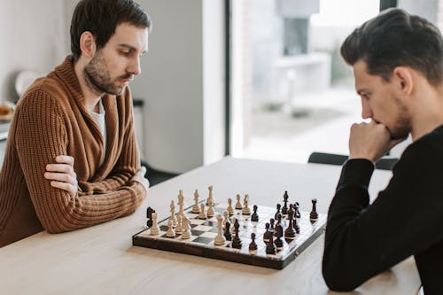 Men Playing a Game of Chess