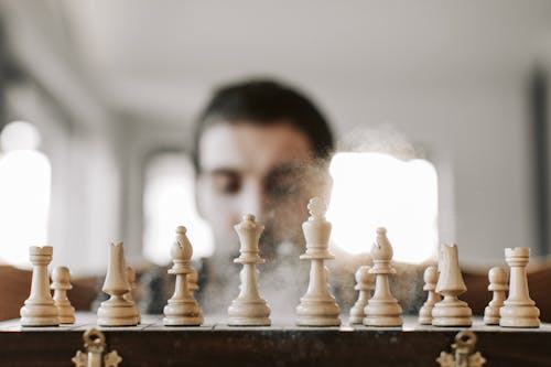 Powder Dust around Chess Pieces