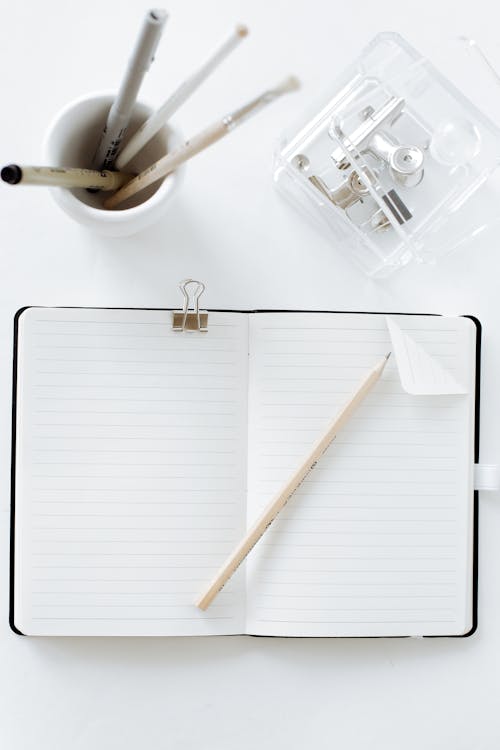 White Notebook and White Pencil