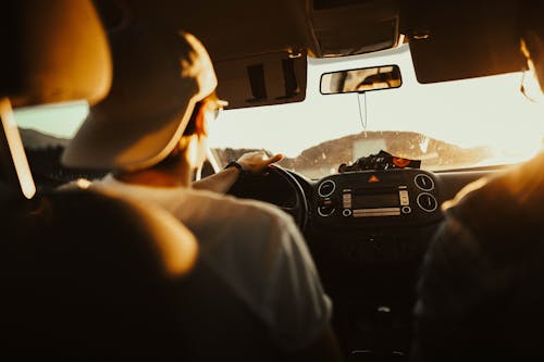 A young boy driving a car