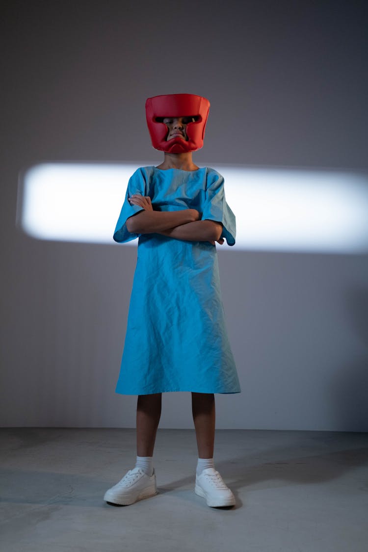 Boy In Robes And Boxing Helmet