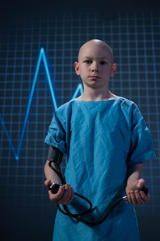Bald child in hospital gown holding stethoscope against medical chart backdrop, highlighting health awareness.