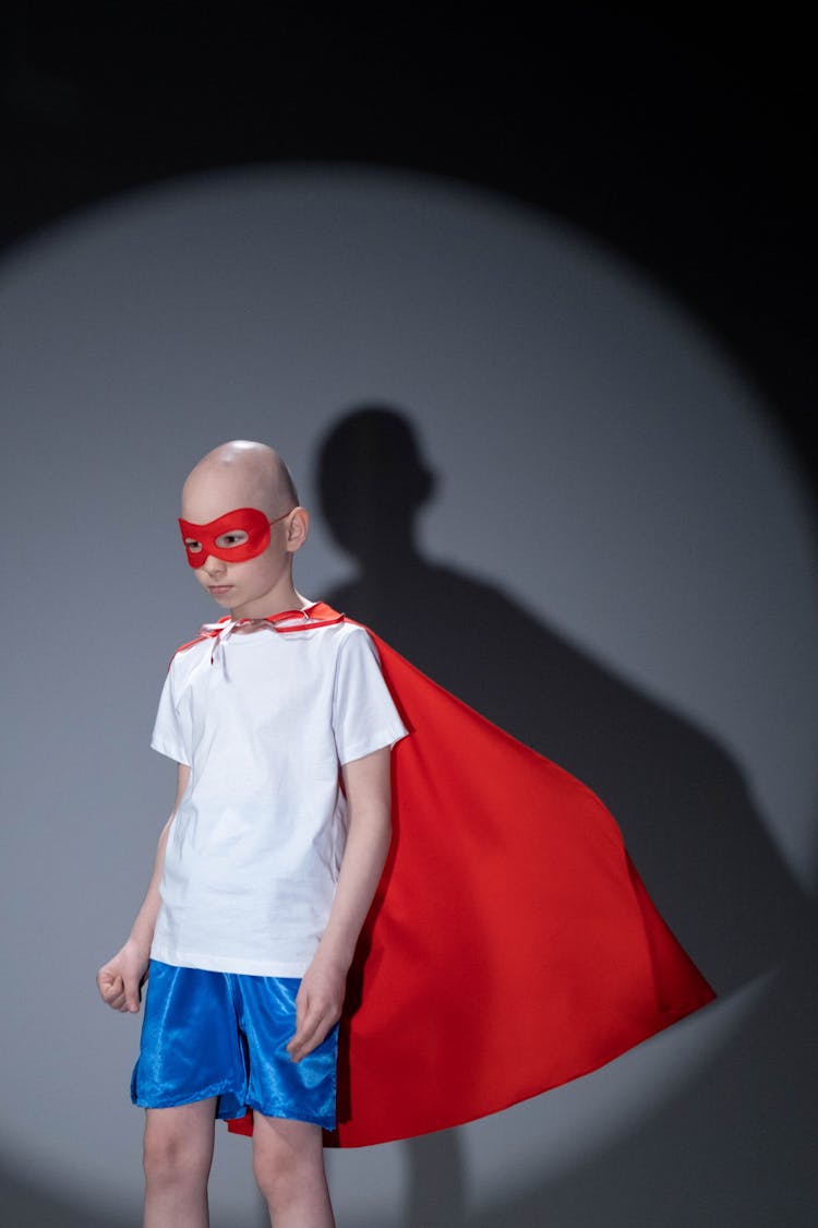 Child Wearing A Superhero Costume