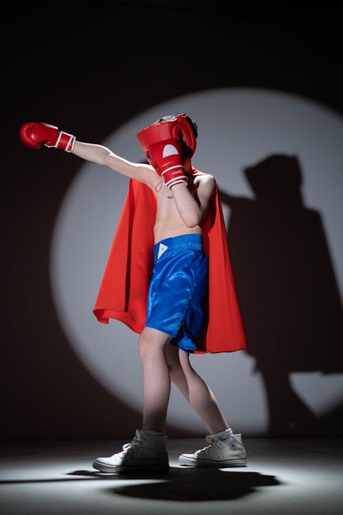 Free Shirtless Child Wearing a Red Cape  Stock Photo