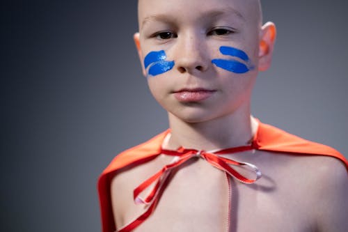 Free Child with Blue Paint on Face Stock Photo