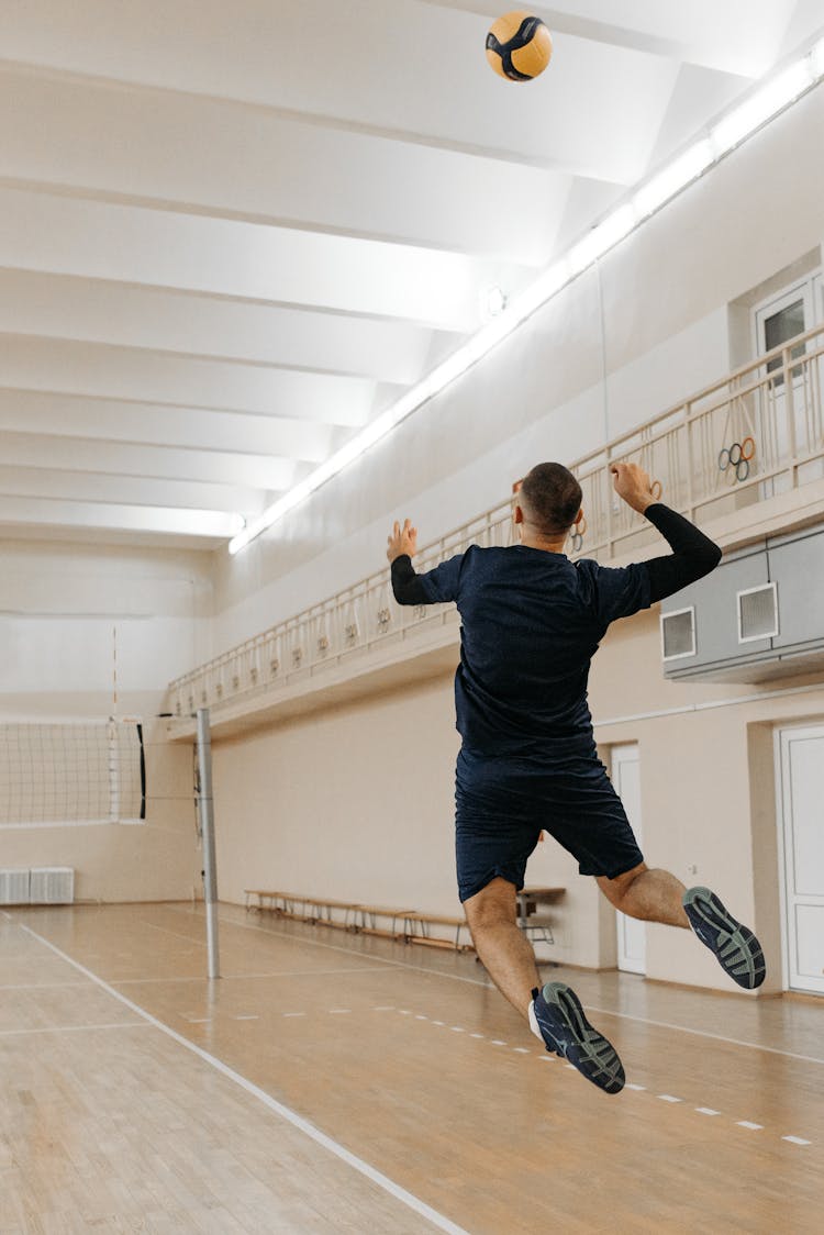 Man Playing Volleyball On The Court