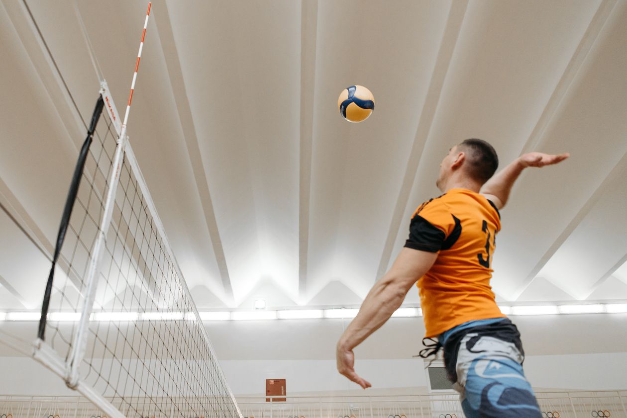 Volleyball player spiking the ball