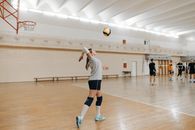 Woman in White Shirt and Black Shorts Playing Volleyball