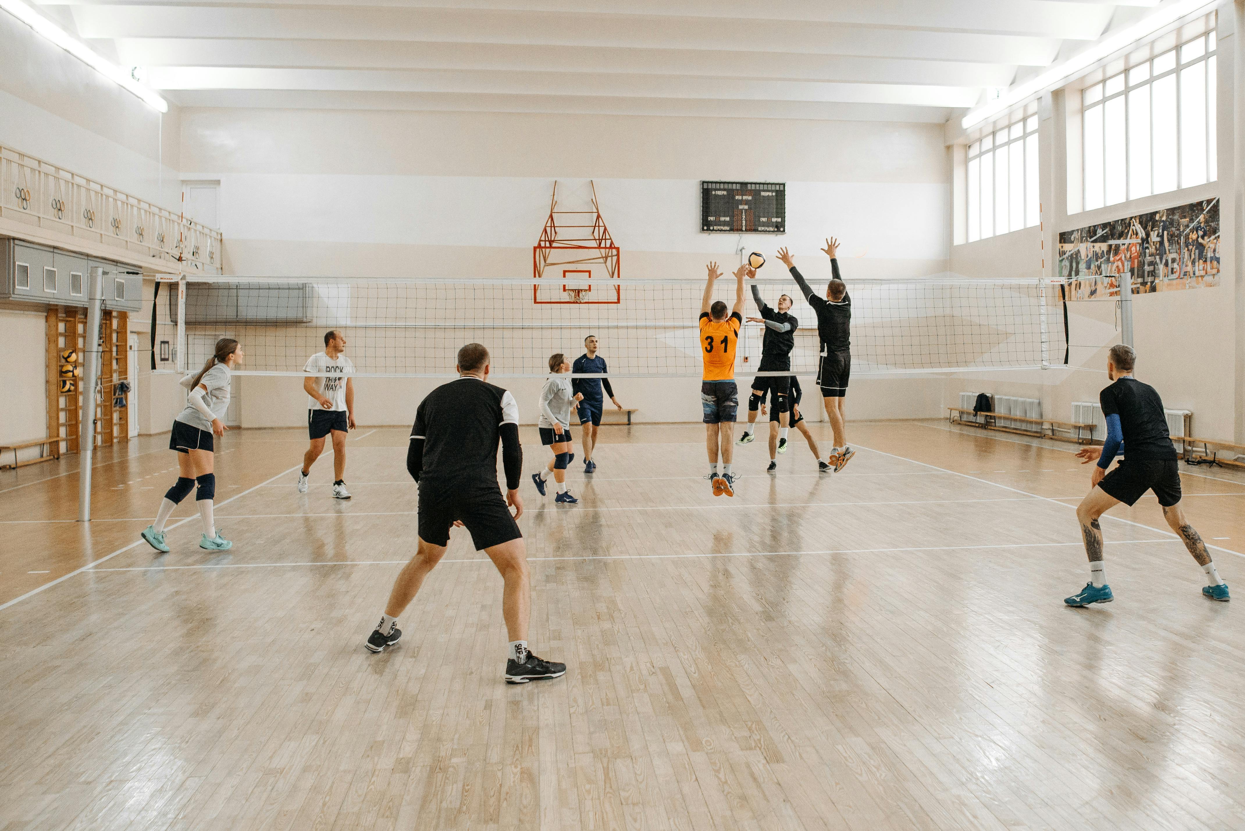 photo of athletes playing volleyball