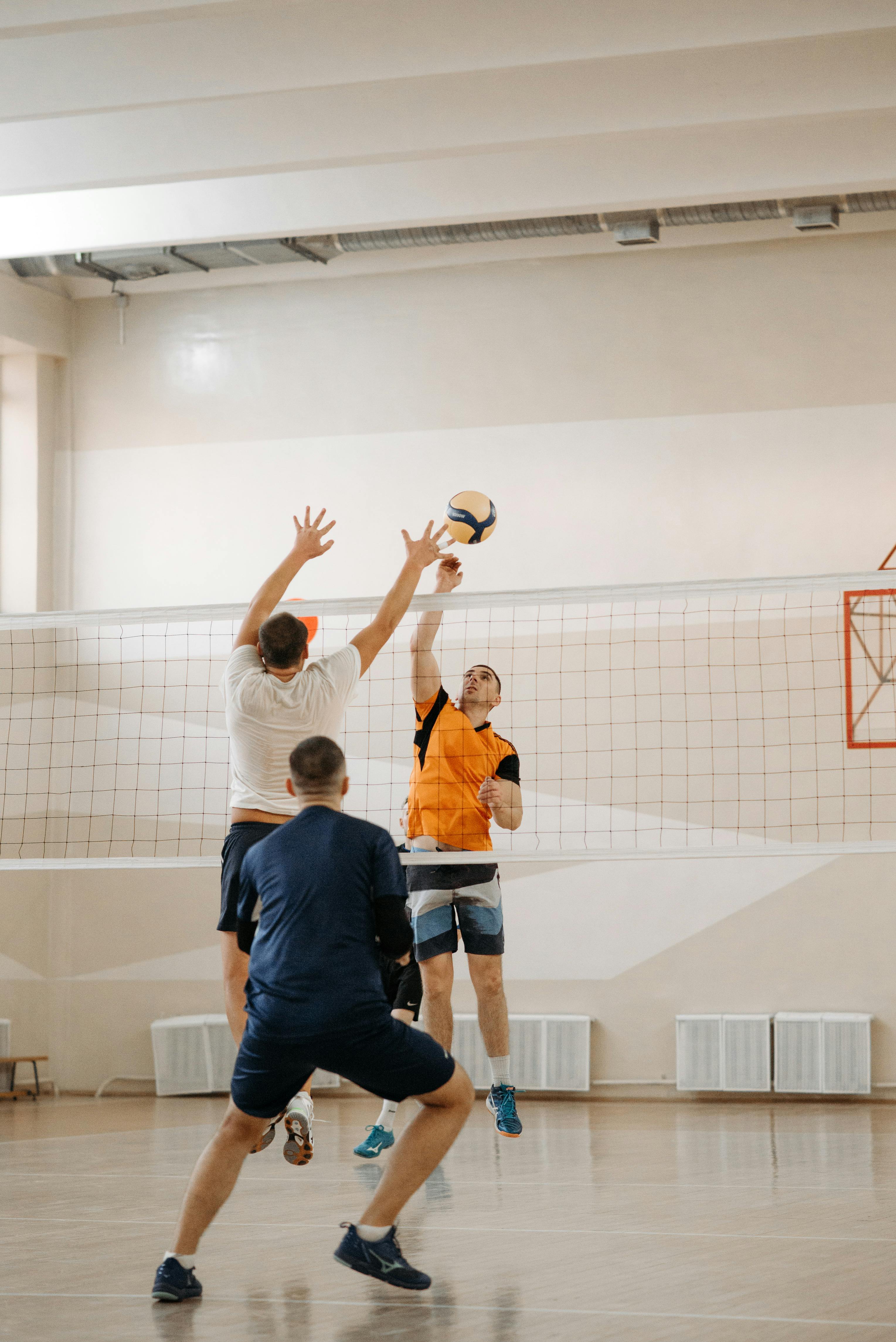 Photo of Men Playing Volleyball · Free Stock Photo