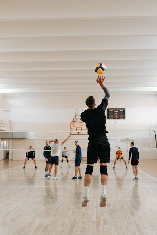 Man in Gray Shirt and Black Shorts Playing Basketball