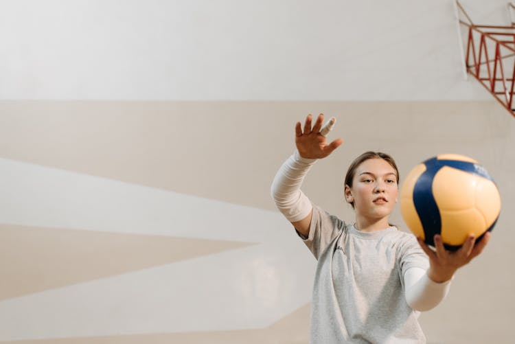 Photo Of A Woman Preparing To Serve A Volleyball