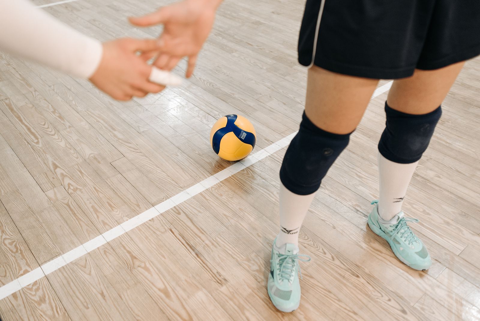Person adjusting an ankle support before light activity during recovery