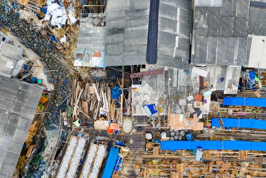 Aerial shot of densely packed rooftops in Jakarta, highlighting urban poverty.