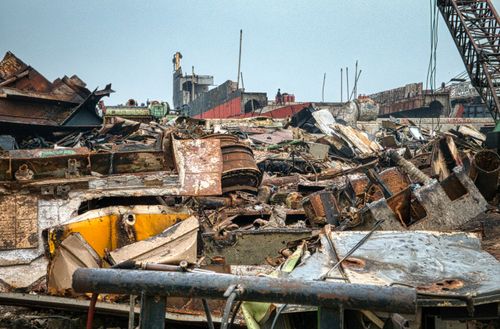 Free Metal rusty worn out constructions with cargo crane on dump in neglected area Stock Photo