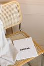 White Textile on Brown Chair