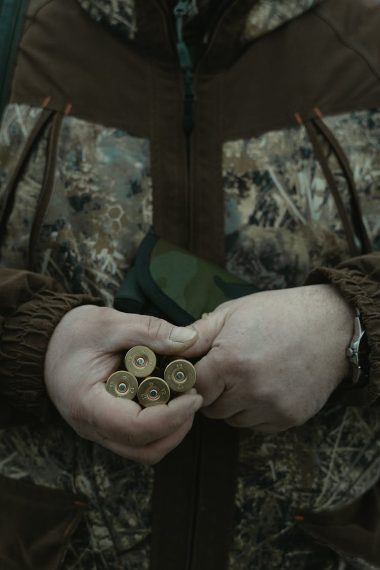 Photo Of A Person Holding Bullets