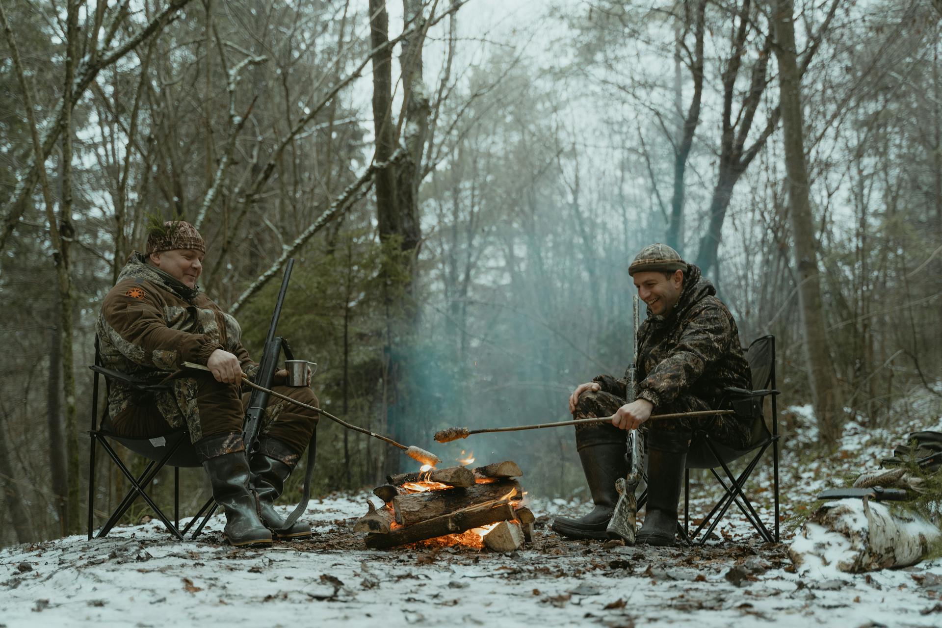 Hunters Sitting by a Campfire