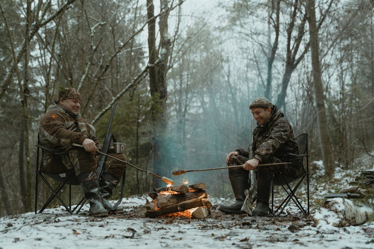 Hunters Sitting By A Campfire