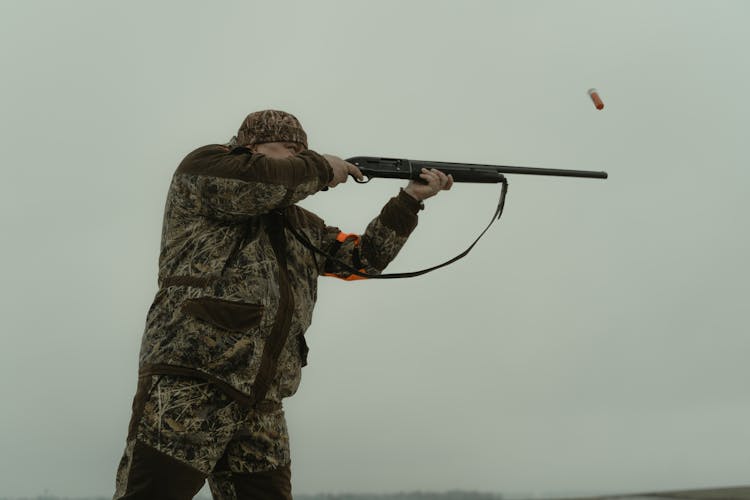 Photo Of A Man Firing His Shotgun