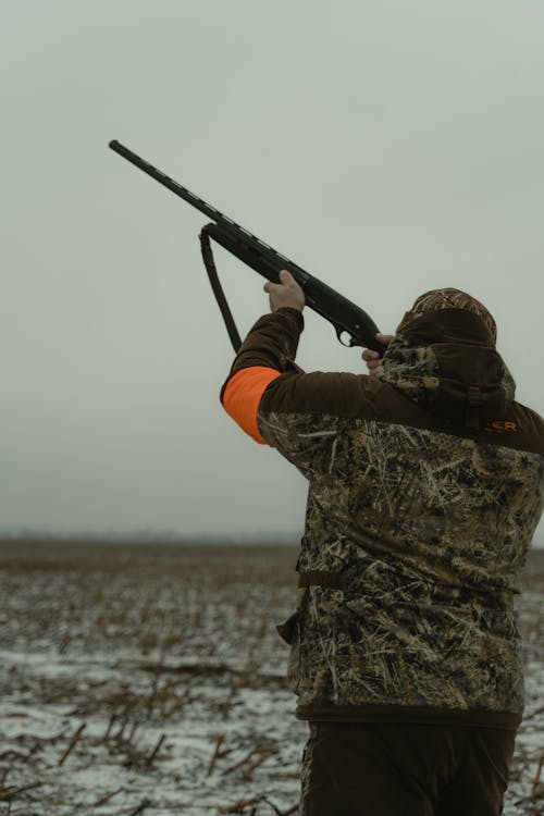 Photo of a Man Aiming His Firearm