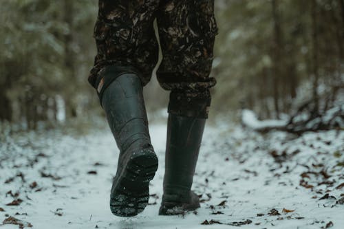 Free Photograph of a Person with Black Boots Walking on the Snow Stock Photo