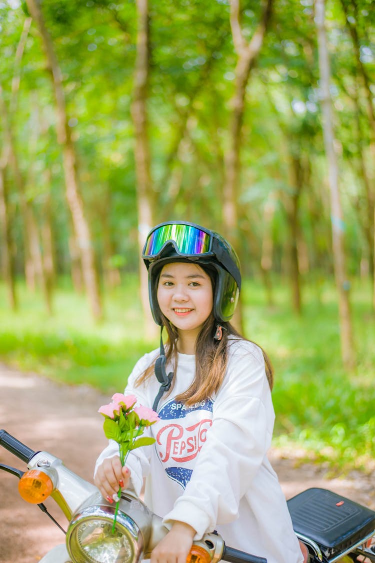 Smiling Girl In Helmet Sitting On Motorbike