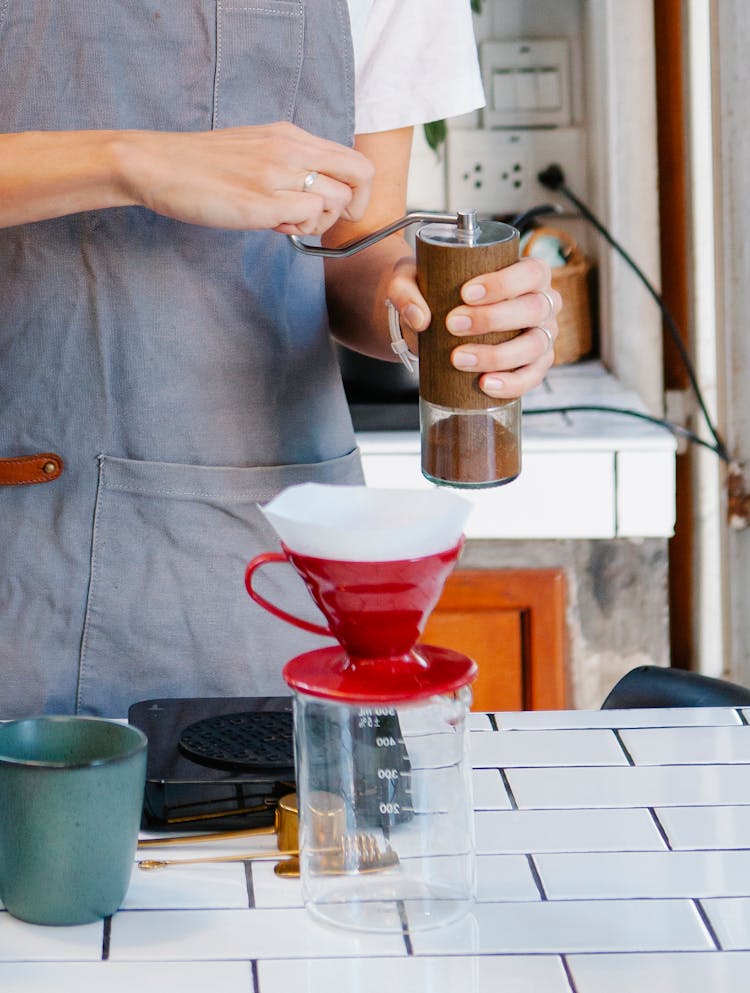 Barista Grinding Coffee Beans For Filter Coffee